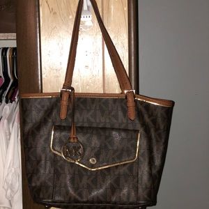 Brown Michael Kors monogram bag.